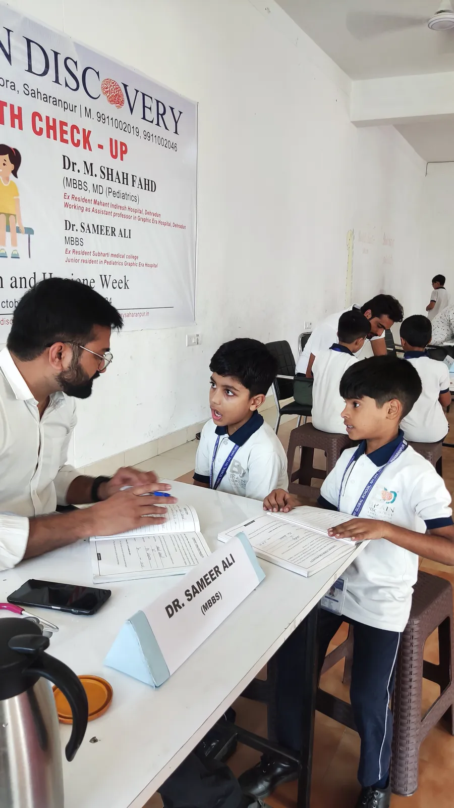 Primary students with their forms at the second doctor’s table